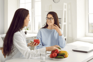 nutritionist and woman talking