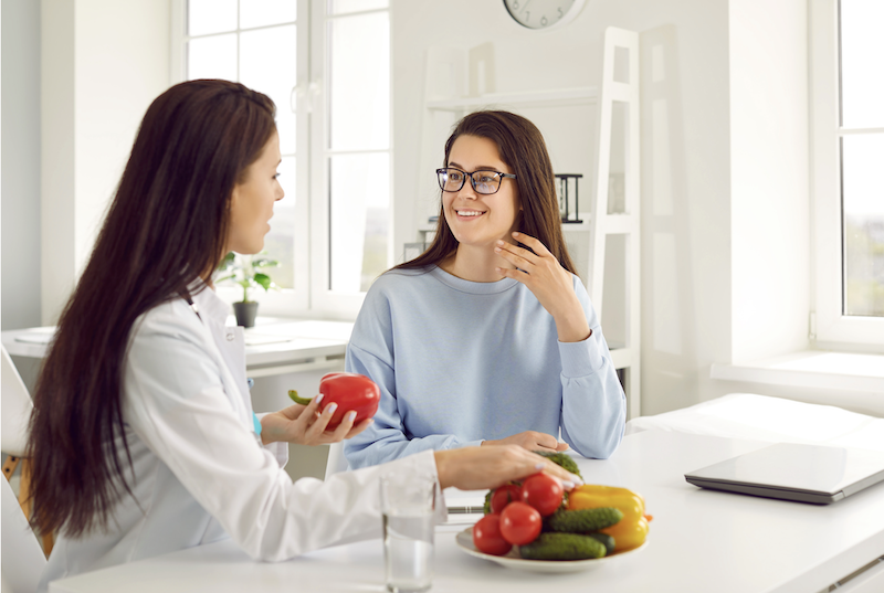 nutritionist and woman talking