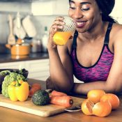 woman drinking orange juice