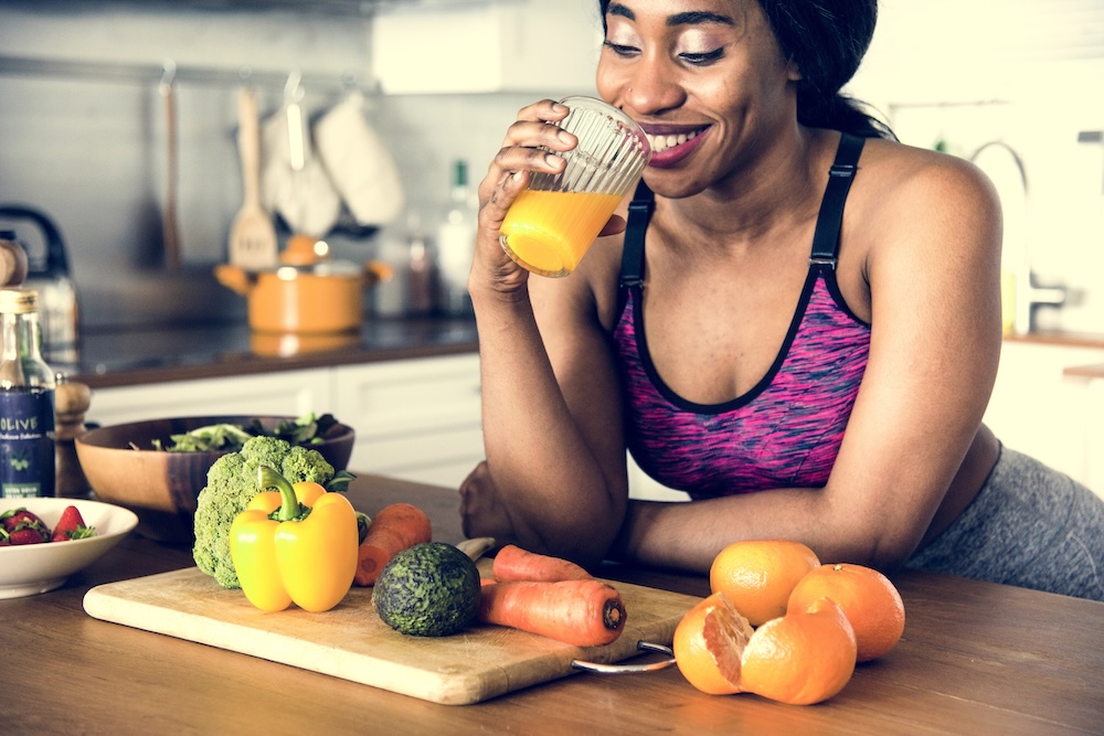 woman drinking orange juice